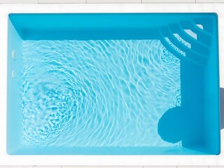 Tranquil water surface of a private swimming pool with sunlight reflections