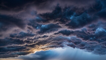 Upward view of dramatic storm clouds with deep contrast and rich atmospheric texture, wide open sky creating a powerful mood for weather, nature, and cinematic background concepts.