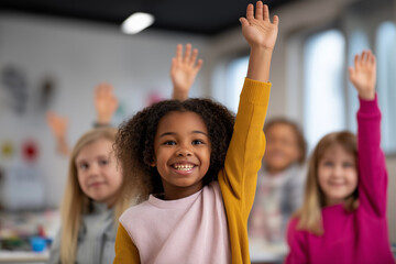 Happy diverse children raising hands in classroom