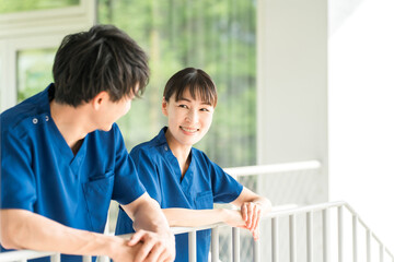 Male and female medical staff (nurses, caregivers, care workers) wearing scrubs in hospitals and...