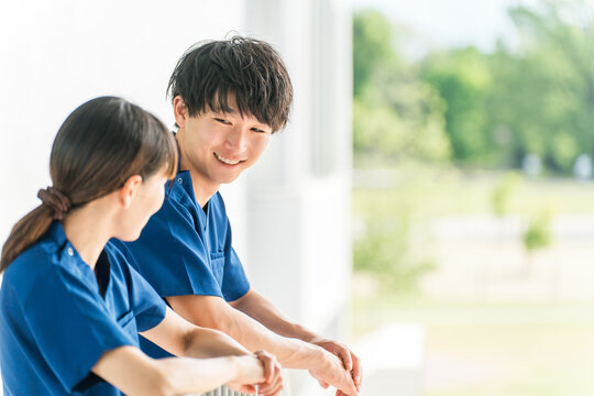 Male and female medical staff (nurses, caregivers, care workers) wearing scrubs in hospitals and facilities