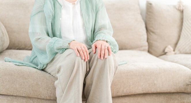 Senior woman relaxing on the sofa in the living room