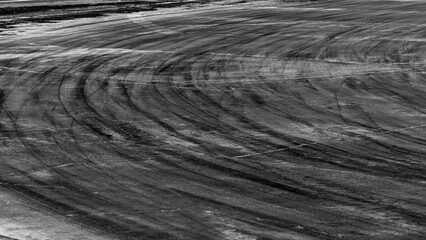 abstract asphalt street road background with black tire marks on race track, Texture and background car automobile and automotive skid tire marks. © Kalyakan