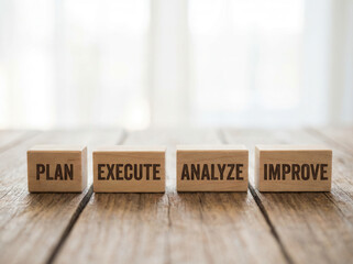 Wooden cubes showing workflow optimization stages placed with crisp foreground and gentle soft white blur behind