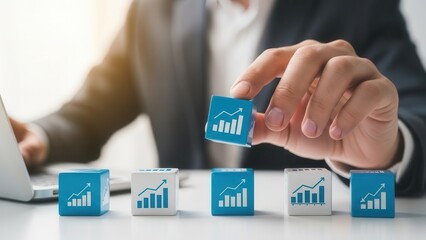 Human hand arranging productivity enhancement cubes with controlled depth and bright subtly blurred surroundings