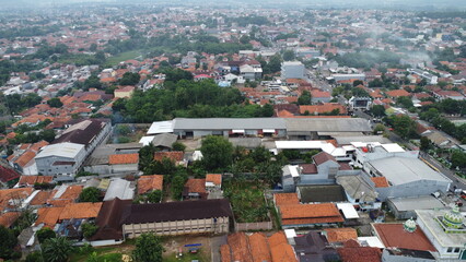 Aerial view of urban landscape with buildings and trees captured from above