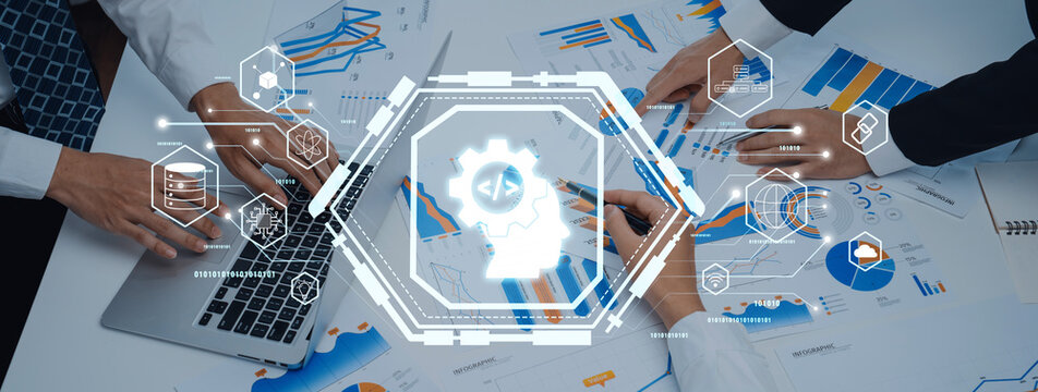 Engaging image showcasing collaborative business analysis with technology integration, emphasizing data visualization and teamwork in a professional office setting. Trope - Powered by Adobe