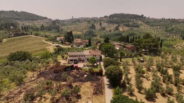 Aerial views of houses on a hill in Impruneta near Florence, Italy, featuring the scenic Tuscan landscape. On a beautiful summers day.