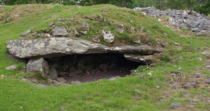 Mid panning right to left shot of the Dunchraigaig Cairn chamber Entrance near the Nether Largie Standing Stones at Kilmartin
