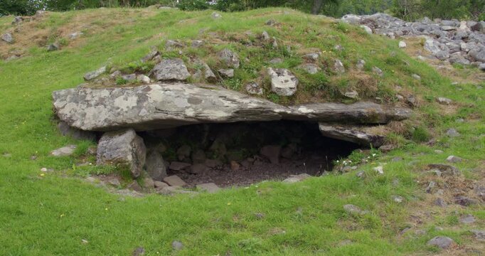 Mid panning left to right shot of the Dunchraigaig Cairn chamber Entrance near the Nether Largie Standing Stones at Kilmartin