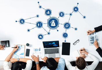 A modern workspace featuring professionals engaged in financial analysis and data management. Tools and technology assist in effective collaboration and strategy development. Amity