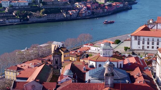 Porto historic center on Douro River, medieval church of Saint Francis and The Stock Exchange Palace buildings, Drone shot