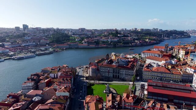 Porto market square, Church of Saint Francis, The Stock Exchange Palace with Vila Nova de Gaia on the other side of Douro river, Drone shot