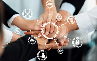 A dynamic representation of teamwork and collaboration with multiple hands placed together,...