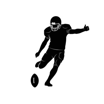 American football player in action kicking the ball with determination