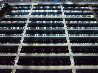 Night View of Solar Canopy Parking Lot with Illuminated Panels