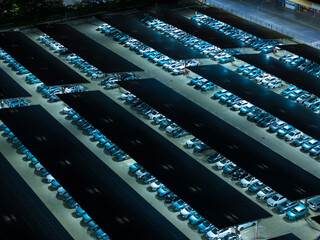 Night View of Solar Canopy Parking Lot with Illuminated Panels