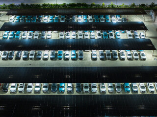 Night View of Solar Canopy Parking Lot with Illuminated Panels