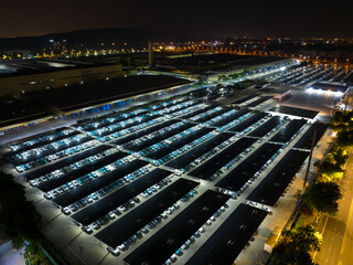 Night View of Solar Canopy Parking Lot with Illuminated Panels
