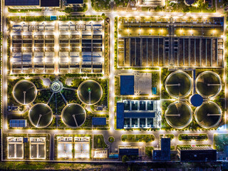 Aerial Night View of Illuminated Wastewater Treatment Plant