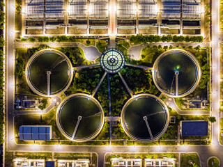 Aerial Night View of Illuminated Wastewater Treatment Plant