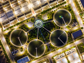 Aerial Night View of Illuminated Wastewater Treatment Plant