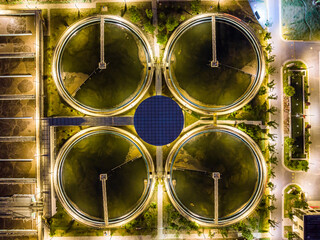 Aerial Night View of Illuminated Wastewater Treatment Plant