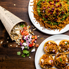 Top View of Assorted Indian Street Food Chaat Including Bhel Puri Sev Puri and Snacks
