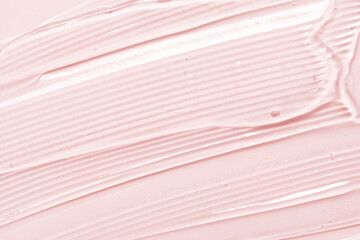 Gel texture. Pink liquid cosmetic background. Skincare serum, beauty cream with bubbles closeup