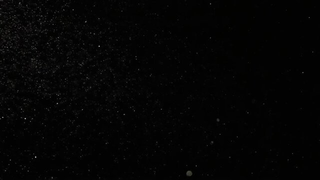 Stark Black Background with White Speckles Resembling Starry Night Sky in Minimalist Abstract Design Composition