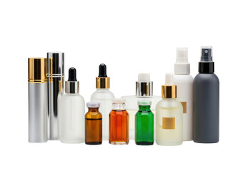 Elegant grouping of luxury cosmetic and fragrance bottles, polished metallic caps, thick reflective glass against a high-key white background with copy space. Concept for luxury beauty advertising