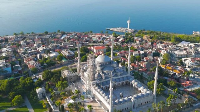 Istanbul, Turkey. Blue Mosque surface details. Ottoman ceramic tiles, stonework and minaret base at Sultanahmet Square, morning. Aerial View, MasterShots, Spiral forward