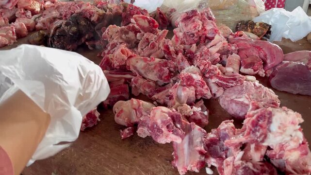 Goat meat cuts at the market. Buying goat meat at a traditional market