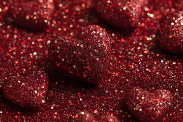 Sparkling hearts. Heart shape red glitter bright background. Flat lay. Love symbol, Valentine's Day holiday greeting card.