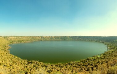Lonar Crater Lake is a unique, saline, alkaline lake in Maharashtra, India, formed by a meteorite impact about 50,000-52,000 years ago, making it the world's only hypervelocity impact crater in basalt © Chandramouli
