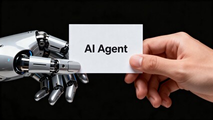 Human hand and robot hand holding card