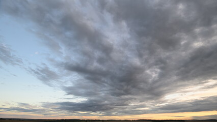 A Dramatic Cloudy Sky at Dusk Unfolds with Spectacular Colors and AweInspiring Beauty
