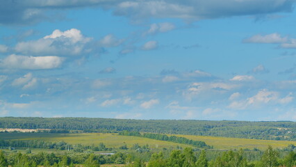 A stunningly beautiful scenic landscape featuring lush green hills under a bright blue sky