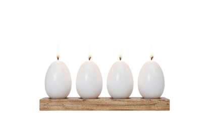 Lit egg-shaped candles on wooden holder.
