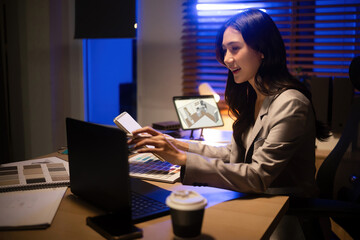 Professional designer planning a 3D interior project, combining digital layout with material samples at night