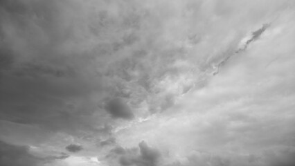 Foreboding sky filled with swirling storm clouds creates dramatic tension, Intense weather...