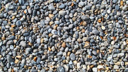 Small gray and brown pebbles texture background