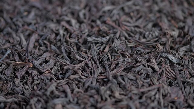 Premium loose tea details, Closeup of dark mahogany tea leaves for branding visuals, Detailed macro image of premium black tea leaves for luxury packaging and branding