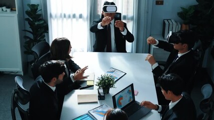 Top view of manager working on laptop and sending data analysis to business people by using VR glass headset while diverse team planning marketing strategy and looking at financial graph. Directorate. - Powered by Adobe