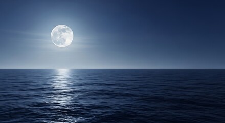 Full moon rising over ocean at night horizon with reflection