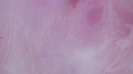 Fototapeta premium Closeup of pork ham texture, Detailed closeup of raw pork ham with marbling and veins, Macro photography capturing raw pork ham surface with pink muscle and fat streaks