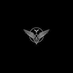 Abstract winged emblem on black modern graphic design concept