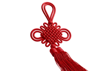 Intricately designed red chinese knot with tassel on white background for decorative purposes