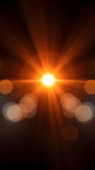 bright golden light flare with soft bokeh glow and radiant energy on dark background