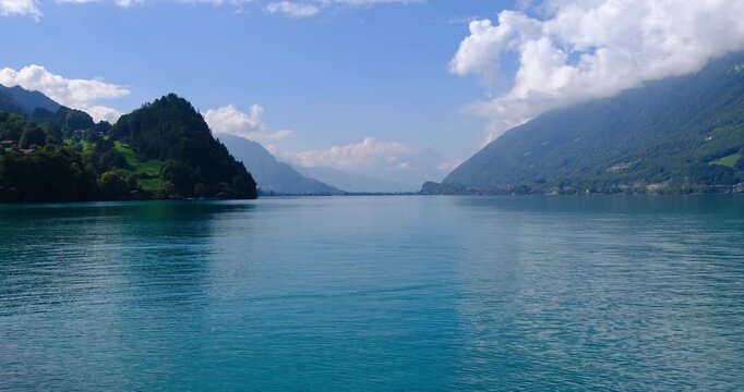 Scenic view of turquoise Lake Brienz with clouds over Alpine mountains, Switzerland
